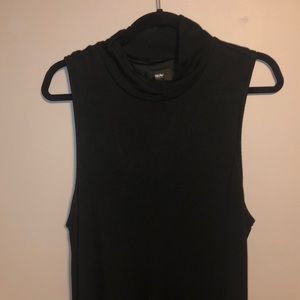 Women’s turtleneck asymmetrical hem line dress